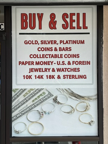 Behr Gold photo of signage in window what he offers.